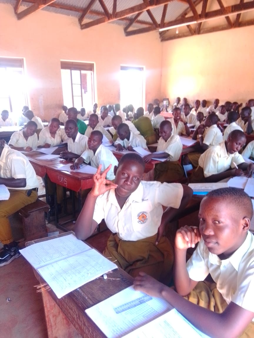 Students learning in a classroom at Abongomola Seed Secondary School